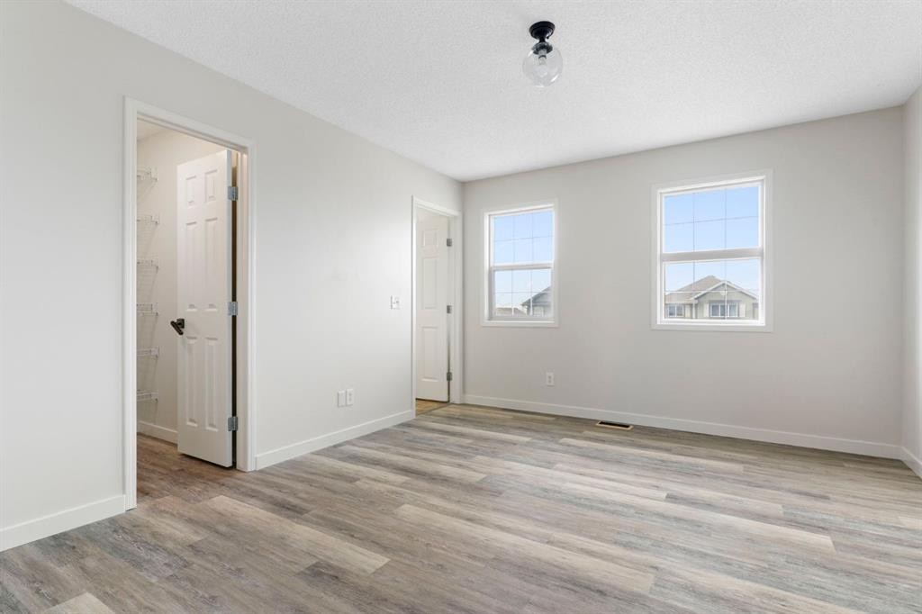 202 Sunset Heights, Cochrane, AB - Indoor Photo Showing Other Room