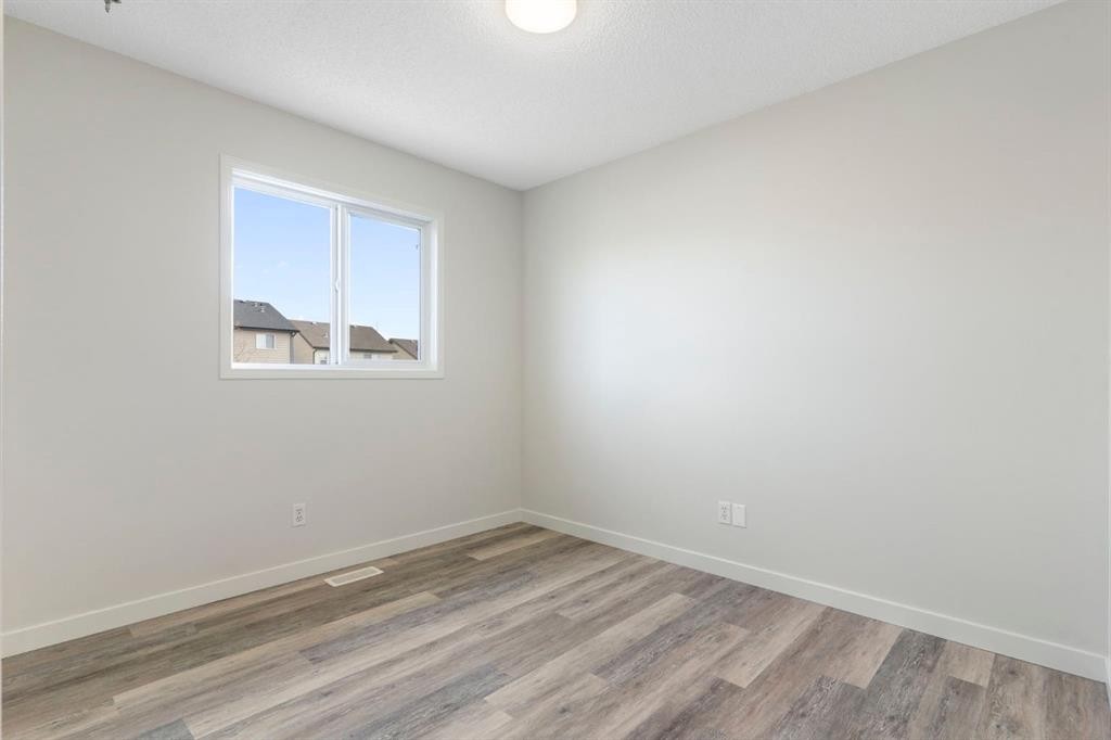 202 Sunset Heights, Cochrane, AB - Indoor Photo Showing Other Room