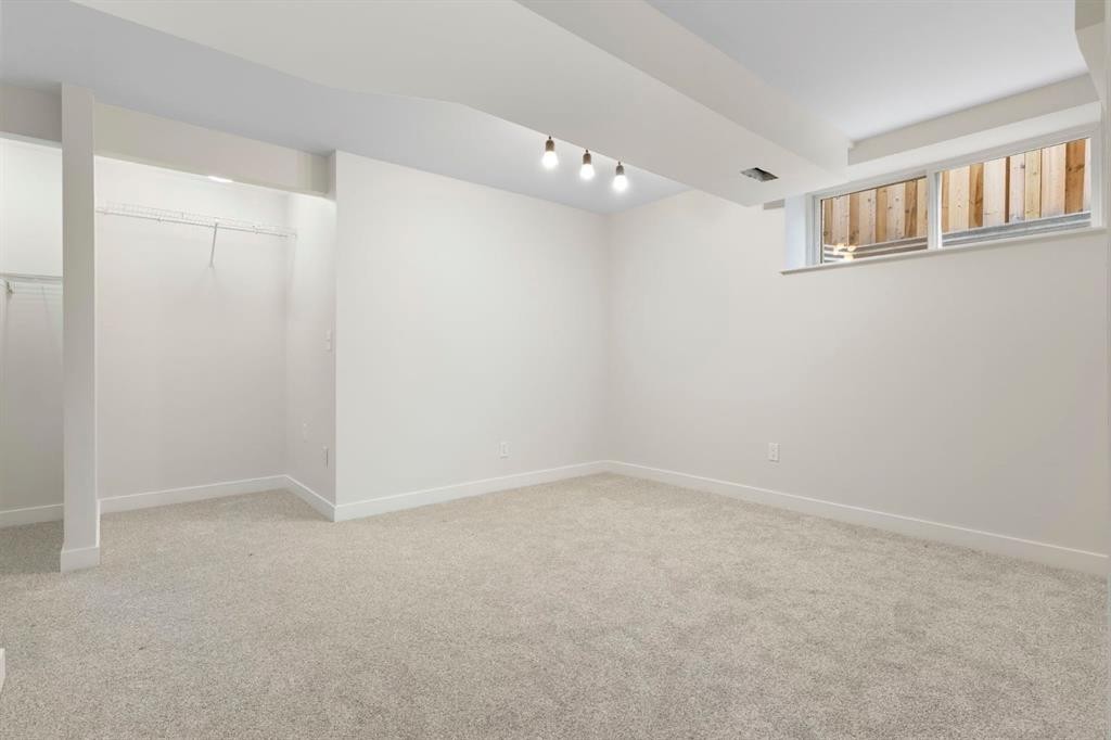 202 Sunset Heights, Cochrane, AB - Indoor Photo Showing Other Room