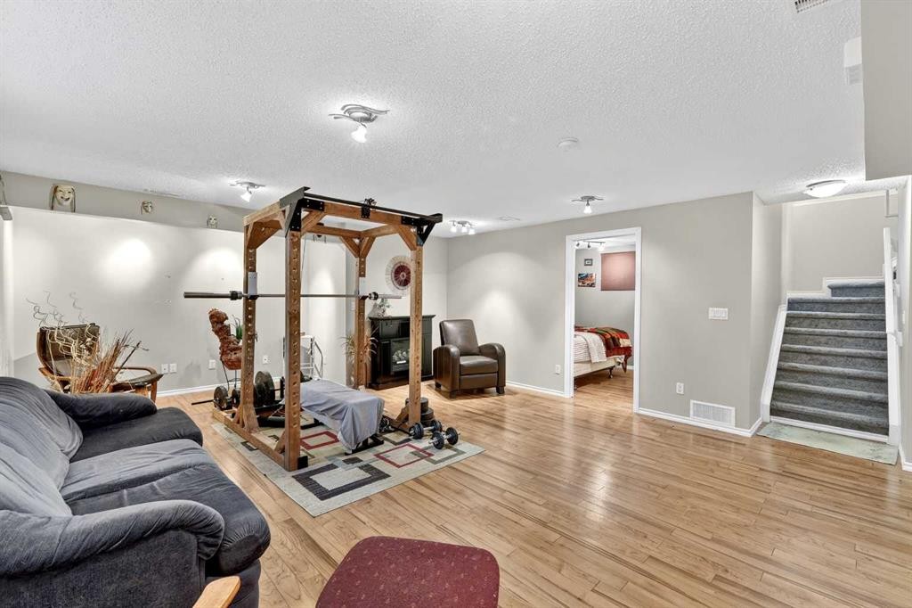 99 Evansmeade Crescent Nw, Calgary, AB - Indoor Photo Showing Gym Room