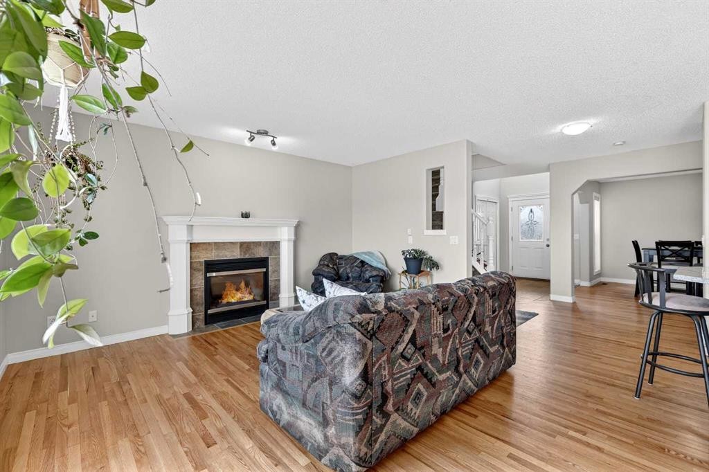 99 Evansmeade Crescent Nw, Calgary, AB - Indoor Photo Showing Living Room With Fireplace