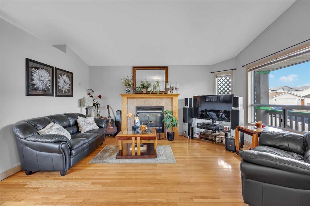 189 Applemead Close Se, Calgary, AB - Indoor Photo Showing Living Room With Fireplace