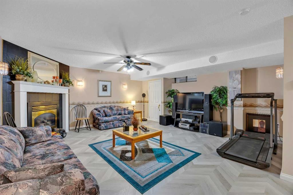 189 Applemead Close Se, Calgary, AB - Indoor Photo Showing Living Room With Fireplace