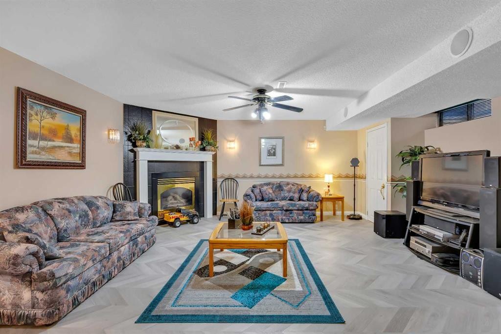 189 Applemead Close Se, Calgary, AB - Indoor Photo Showing Living Room With Fireplace