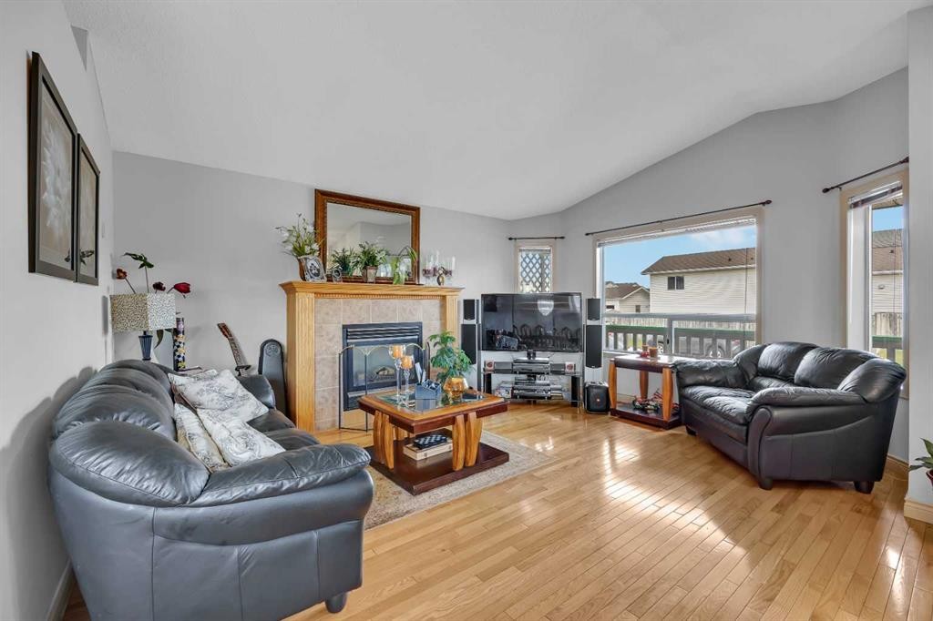 189 Applemead Close Se, Calgary, AB - Indoor Photo Showing Living Room With Fireplace