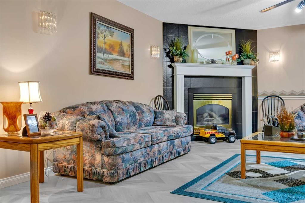 189 Applemead Close Se, Calgary, AB - Indoor Photo Showing Living Room With Fireplace