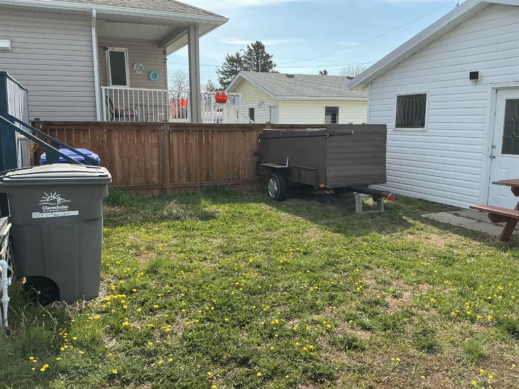 309 52 Avenue West, Claresholm, AB - Outdoor With Deck Patio Veranda With Exterior