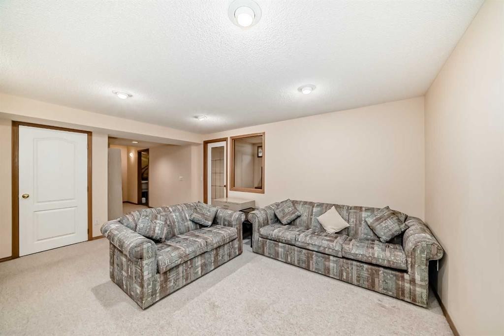 83 Hawkmount Green Nw, Calgary, AB - Indoor Photo Showing Living Room
