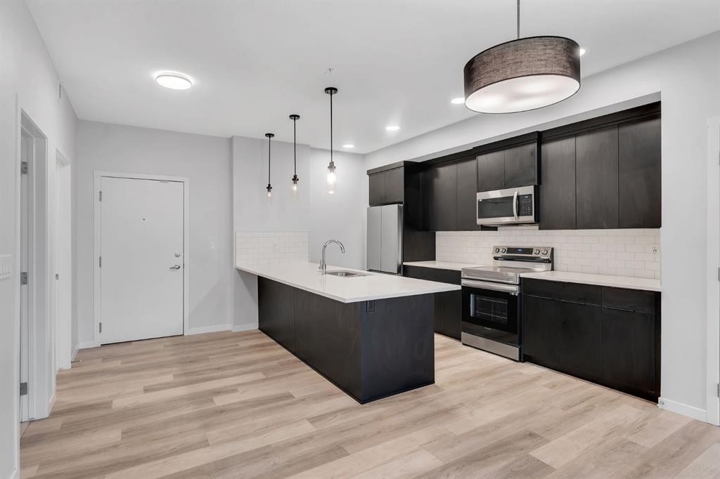 3201-220 Seton Grove Se, Calgary, AB - Indoor Photo Showing Kitchen With Upgraded Kitchen