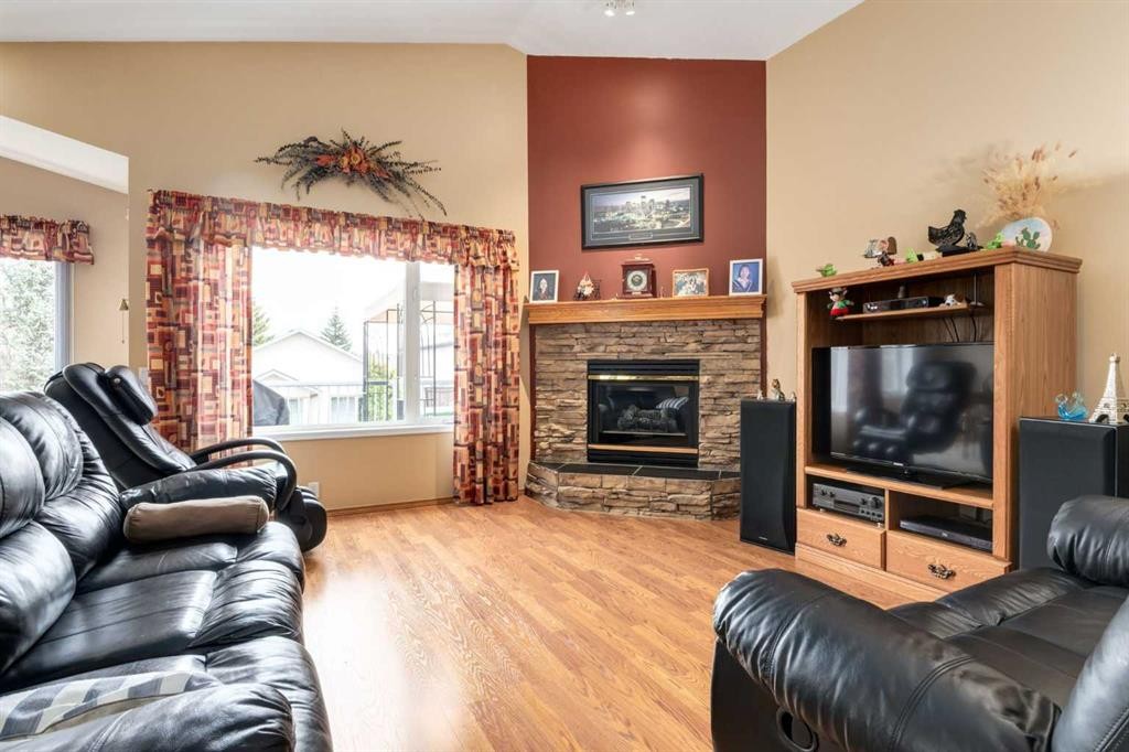 24 Sunmeadows Court Se, Calgary, AB - Indoor Photo Showing Living Room With Fireplace