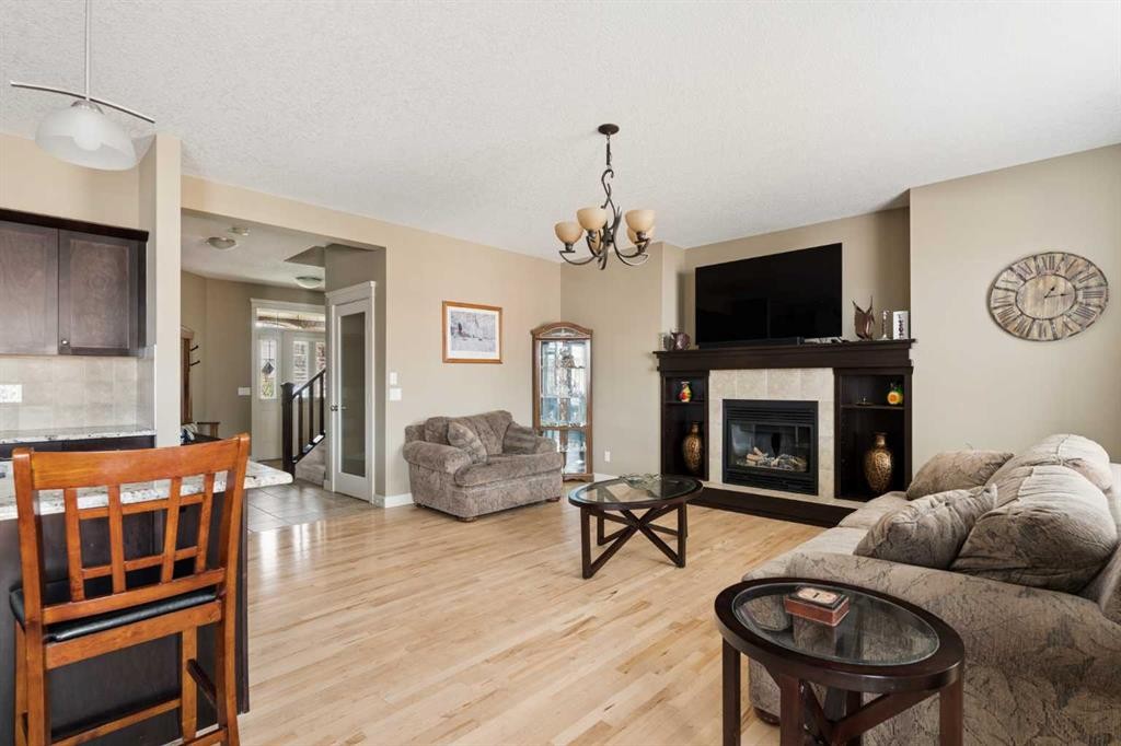 417 Silverado Boulevard Sw, Calgary, AB - Indoor Photo Showing Living Room With Fireplace
