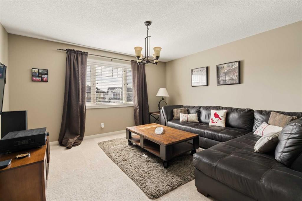 417 Silverado Boulevard Sw, Calgary, AB - Indoor Photo Showing Living Room