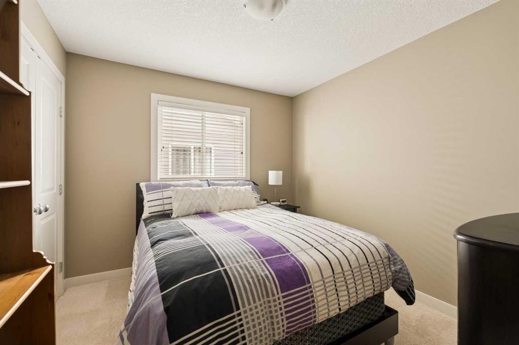 417 Silverado Boulevard Sw, Calgary, AB - Indoor Photo Showing Bedroom