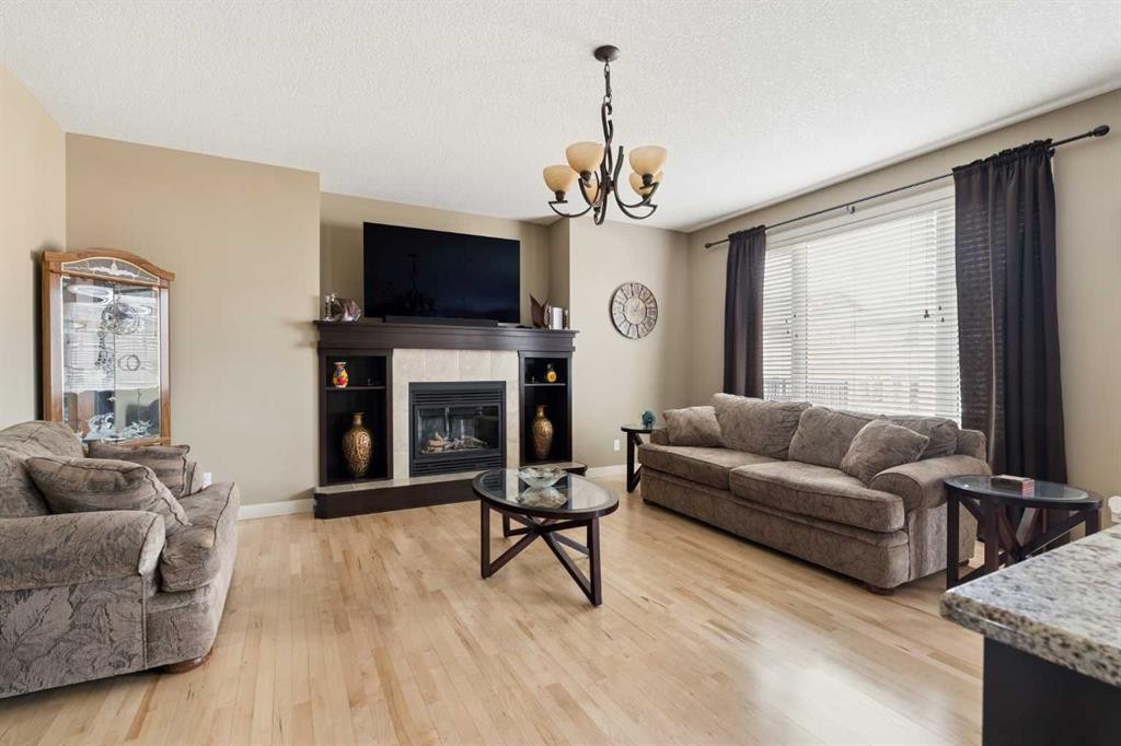 417 Silverado Boulevard Sw, Calgary, AB - Indoor Photo Showing Living Room With Fireplace