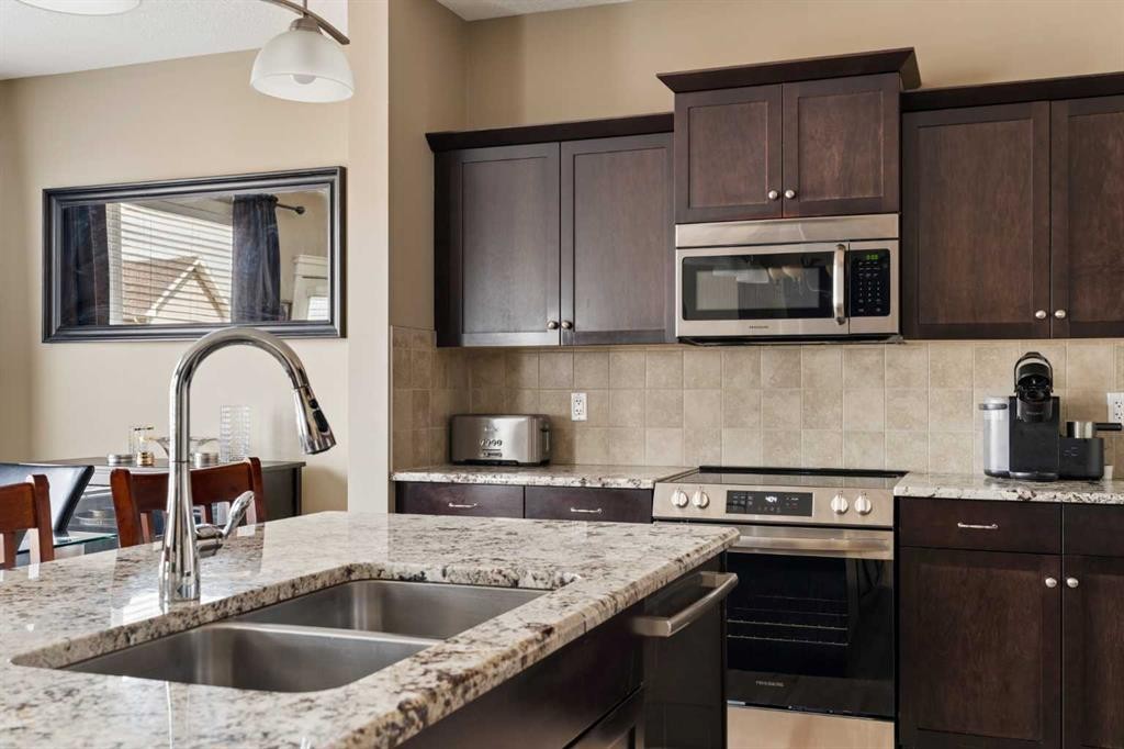417 Silverado Boulevard Sw, Calgary, AB - Indoor Photo Showing Kitchen With Double Sink With Upgraded Kitchen