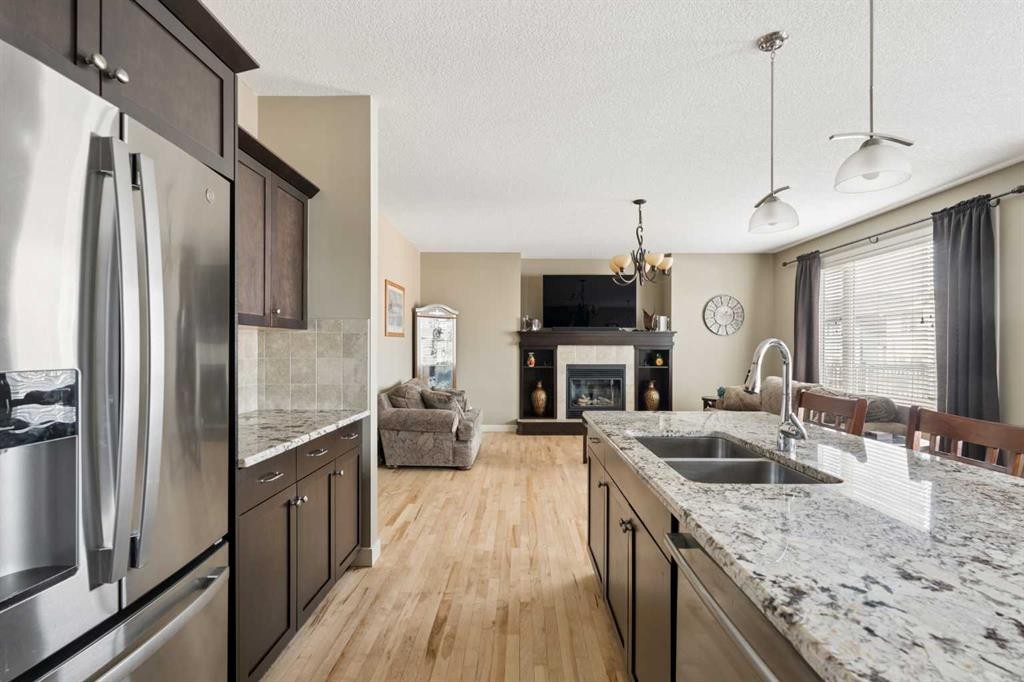 417 Silverado Boulevard Sw, Calgary, AB - Indoor Photo Showing Kitchen With Stainless Steel Kitchen With Double Sink With Upgraded Kitchen