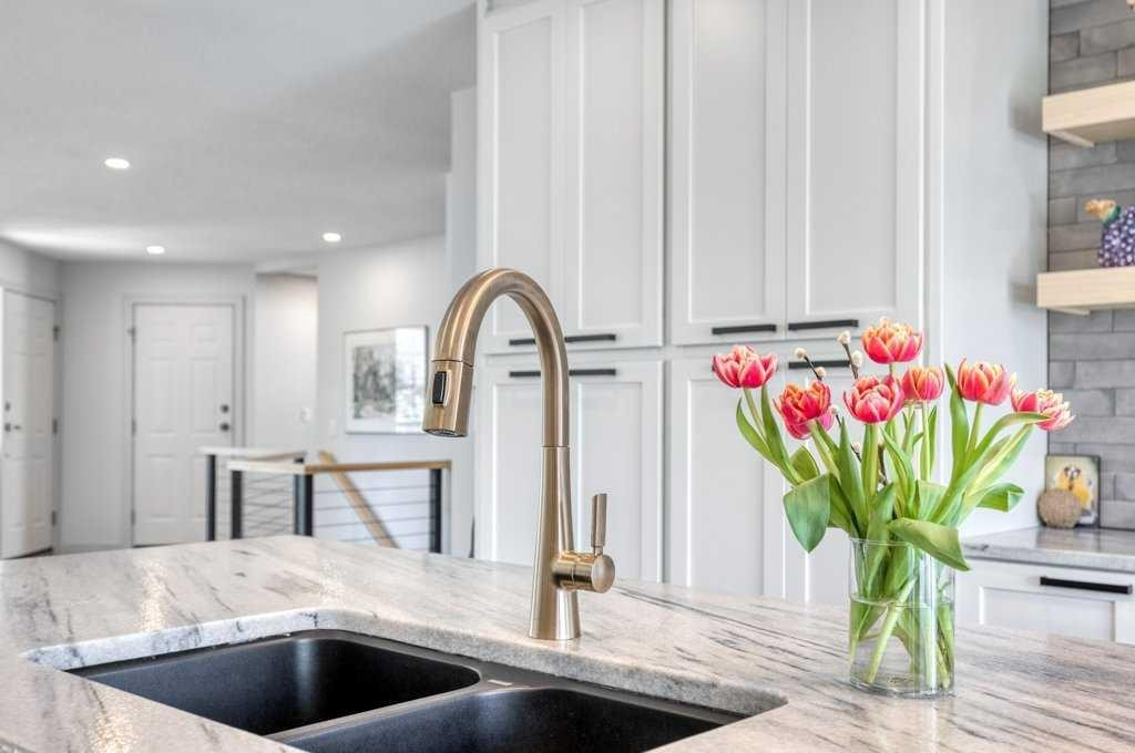 79 Riverview Circle, Cochrane, AB - Indoor Photo Showing Kitchen With Double Sink