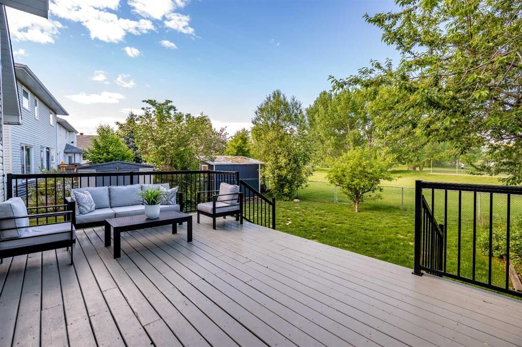 79 Riverview Circle, Cochrane, AB - Outdoor With Deck Patio Veranda With Exterior