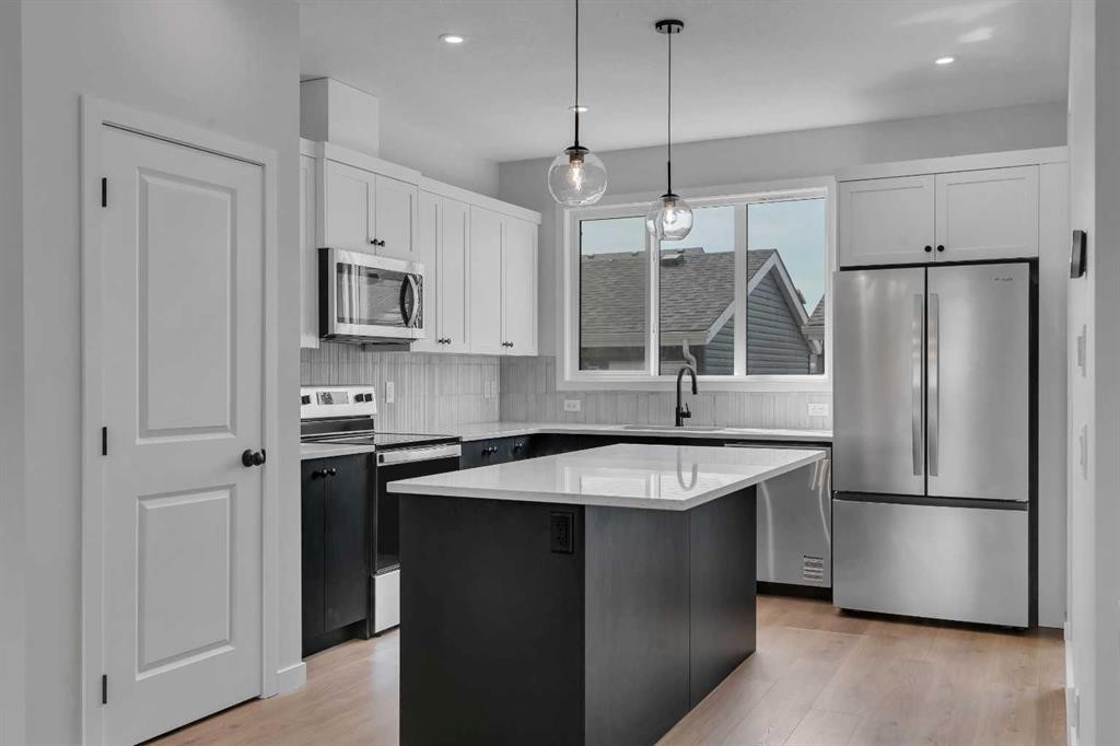 237 Heirloom Way Se, Calgary, AB - Indoor Photo Showing Kitchen With Stainless Steel Kitchen With Upgraded Kitchen