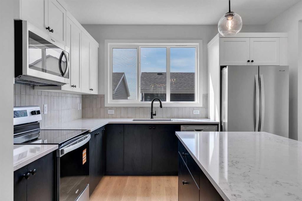 237 Heirloom Way Se, Calgary, AB - Indoor Photo Showing Kitchen With Stainless Steel Kitchen With Upgraded Kitchen