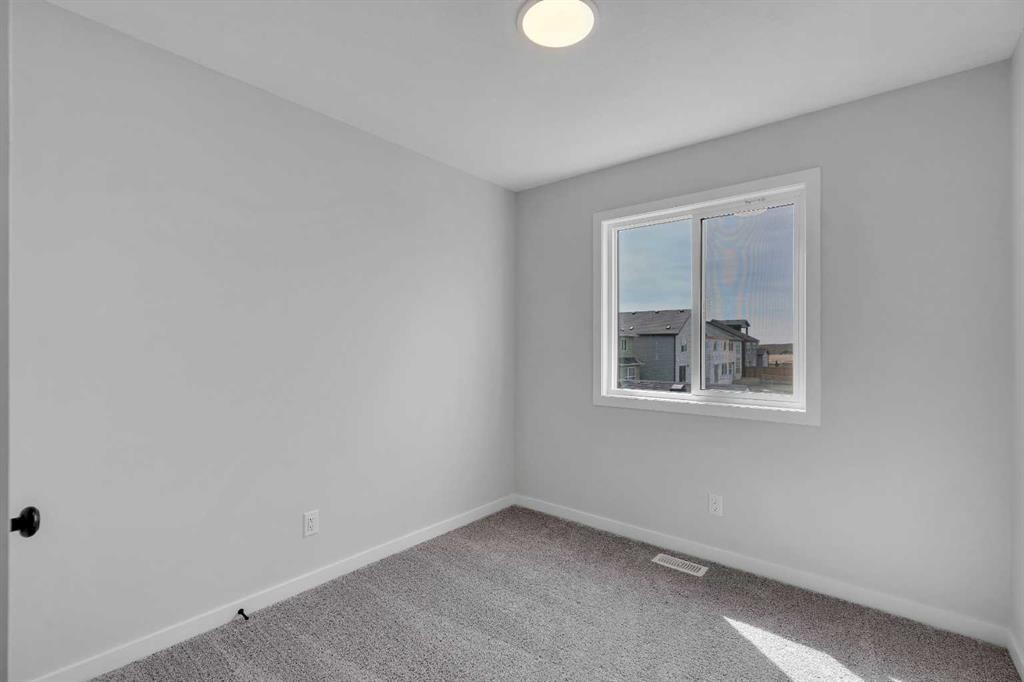 237 Heirloom Way Se, Calgary, AB - Indoor Photo Showing Other Room