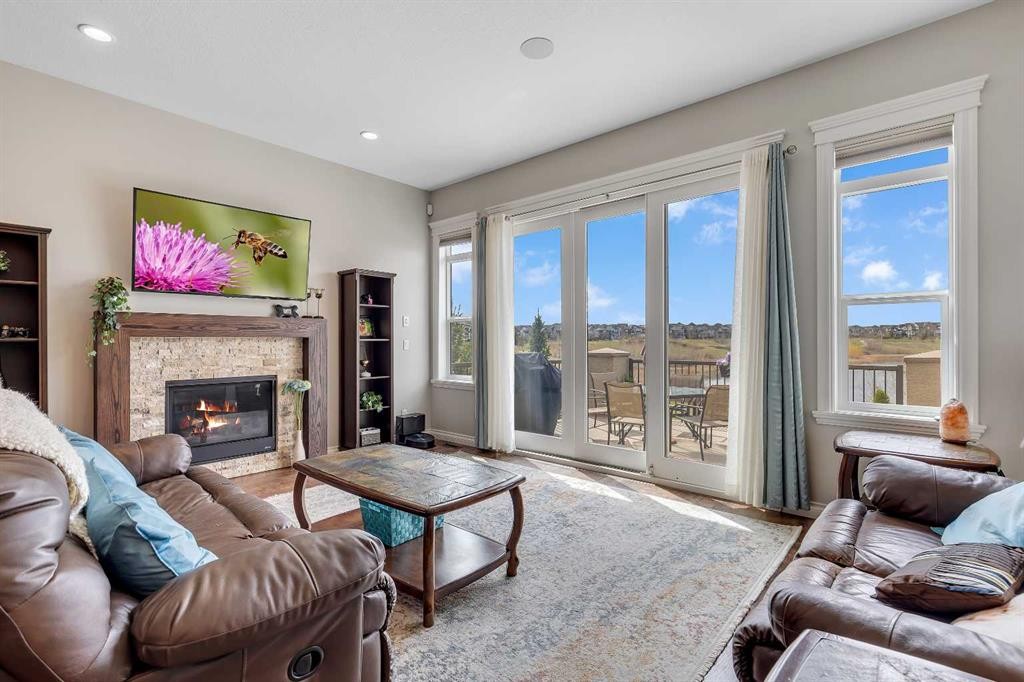 369 Marquis Landing Se, Calgary, AB - Indoor Photo Showing Living Room With Fireplace