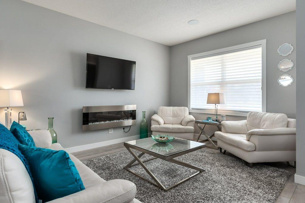 144 Wolf Willow Boulevard Se, Calgary, AB - Indoor Photo Showing Living Room With Fireplace