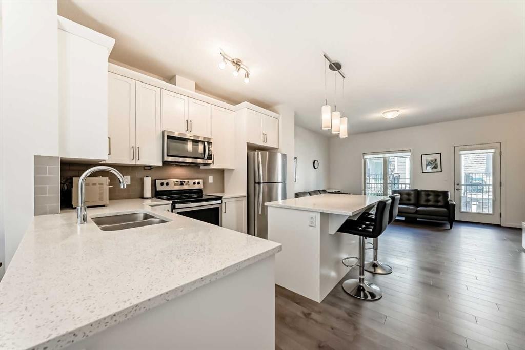 139 Legacy Point Se, Calgary, AB - Indoor Photo Showing Kitchen With Double Sink With Upgraded Kitchen
