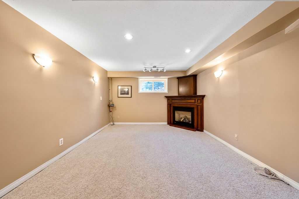5019 Norris Road Nw, Calgary, AB - Indoor With Fireplace
