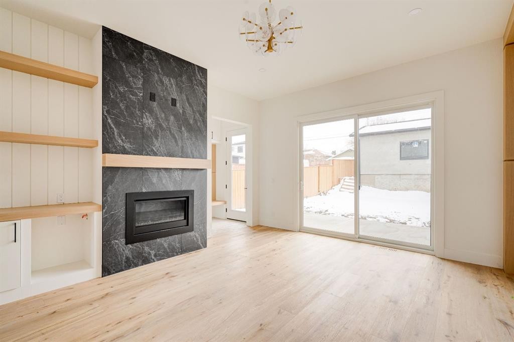 2447 29 Sw, Calgary, AB - Indoor Photo Showing Living Room With Fireplace