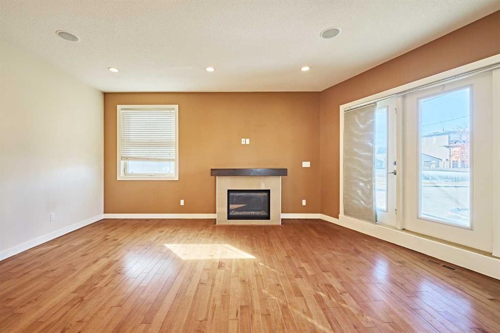1840 Westmount Road Nw, Calgary, AB - Indoor Photo Showing Other Room With Fireplace