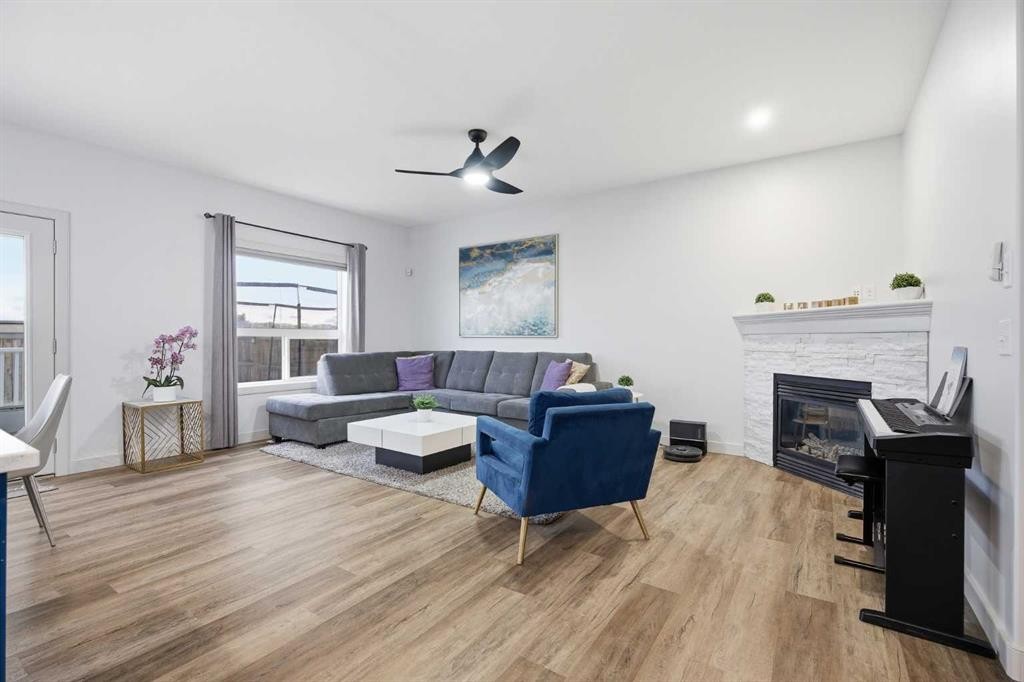 107 Everwoods Park Sw, Calgary, AB - Indoor Photo Showing Living Room With Fireplace