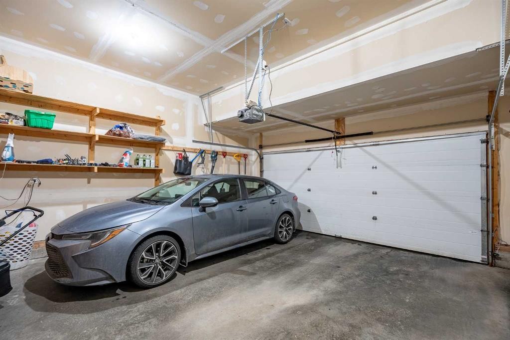 107 Everwoods Park Sw, Calgary, AB - Indoor Photo Showing Garage