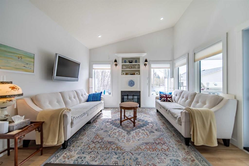 9 Scripps Landing Nw, Calgary, AB - Indoor Photo Showing Living Room With Fireplace