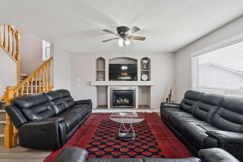 35 Saddletree Drive Ne, Calgary, AB - Indoor Photo Showing Living Room With Fireplace
