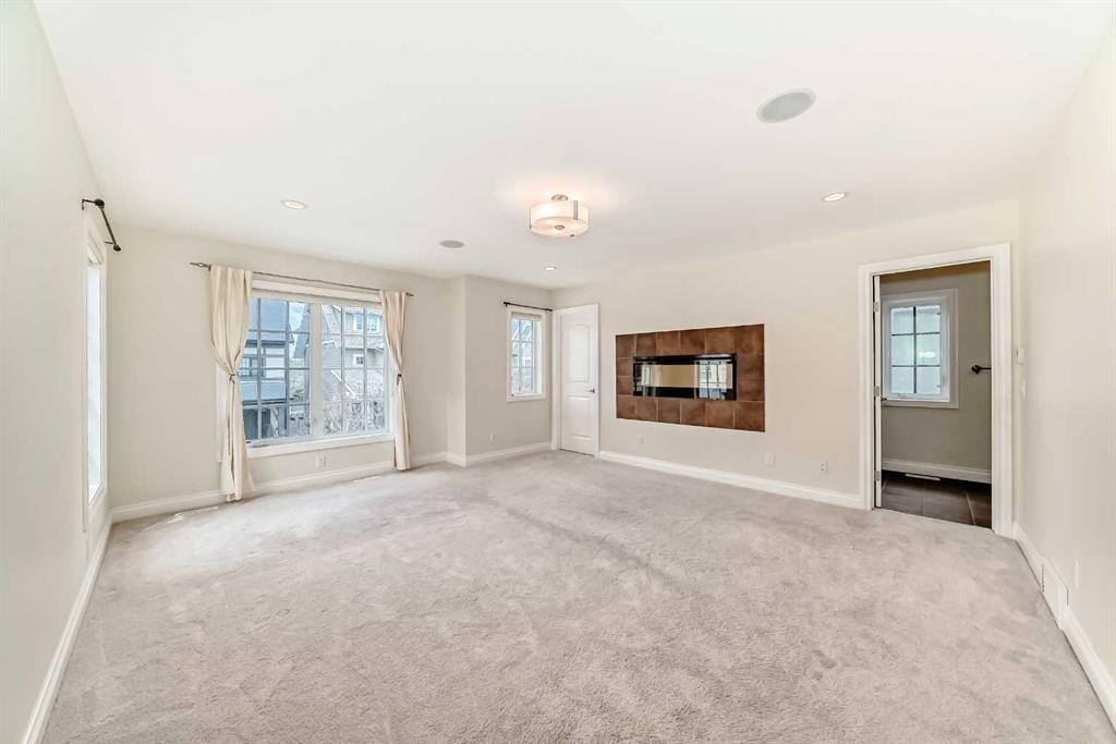 60 Hong Kong Road Sw, Calgary, AB - Indoor Photo Showing Living Room With Fireplace