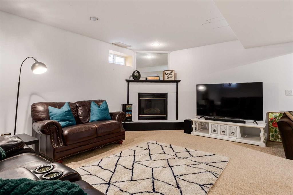 439 Mountain Park Drive Se, Calgary, AB - Indoor Photo Showing Living Room With Fireplace