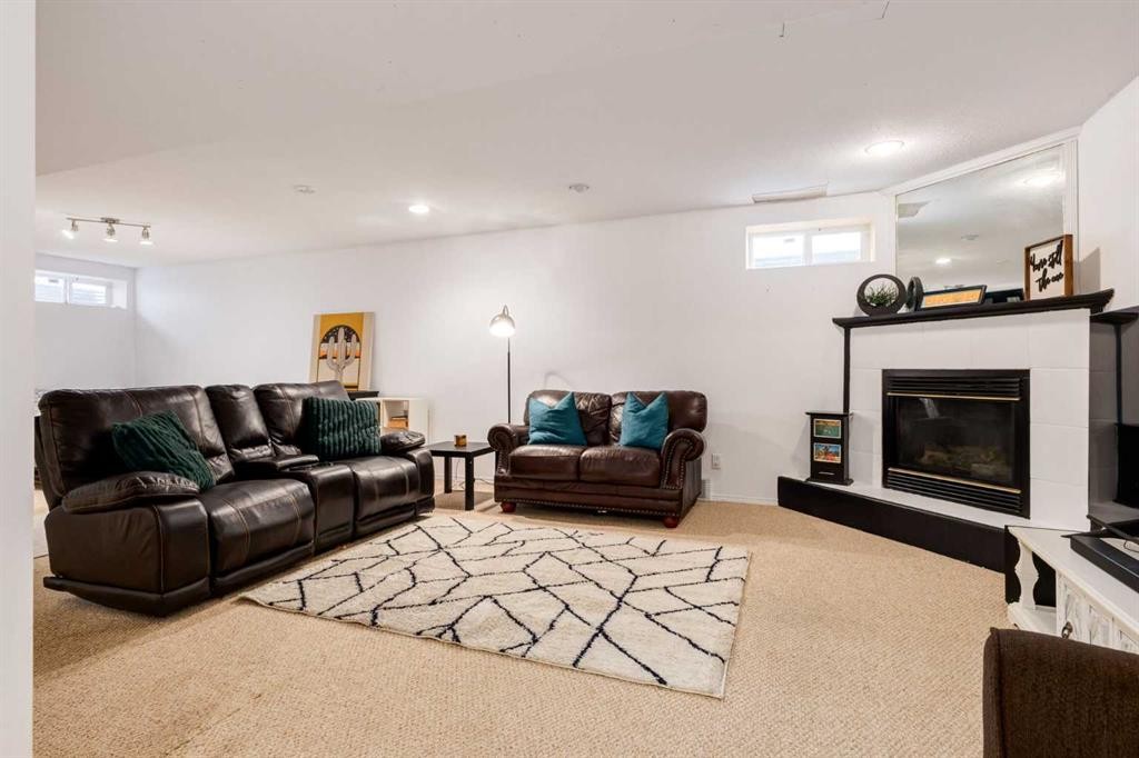 439 Mountain Park Drive Se, Calgary, AB - Indoor Photo Showing Other Room With Fireplace
