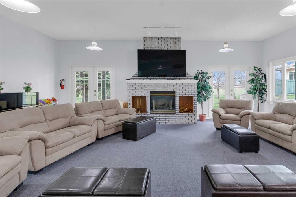 2831 Dovely Park Se, Calgary, AB - Indoor Photo Showing Living Room With Fireplace