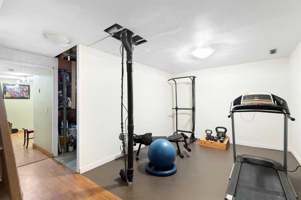 84 Abingdon Crescent Ne, Calgary, AB - Indoor Photo Showing Gym Room