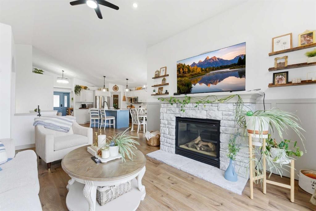 212 Cove Drive, Chestermere, AB - Indoor Photo Showing Living Room With Fireplace