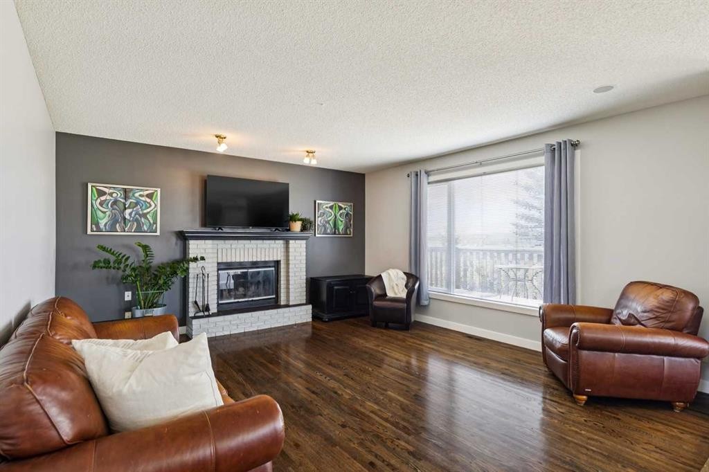 98 Sierra Nevada Green Sw, Calgary, AB - Indoor Photo Showing Living Room With Fireplace