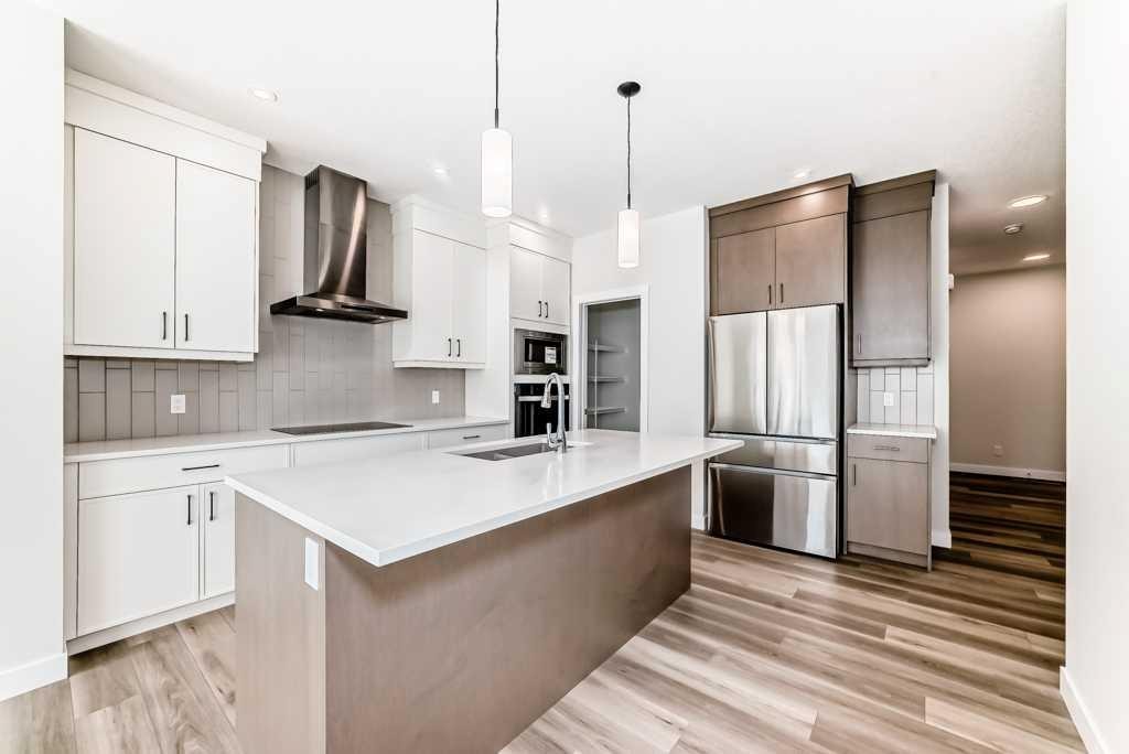 55 Silver Spruce Grove Sw, Calgary, AB - Indoor Photo Showing Kitchen With Double Sink With Upgraded Kitchen