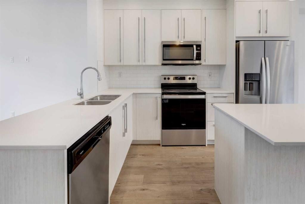 705-50 Cornerstone Passage Ne, Calgary, AB - Indoor Photo Showing Kitchen With Stainless Steel Kitchen With Double Sink With Upgraded Kitchen