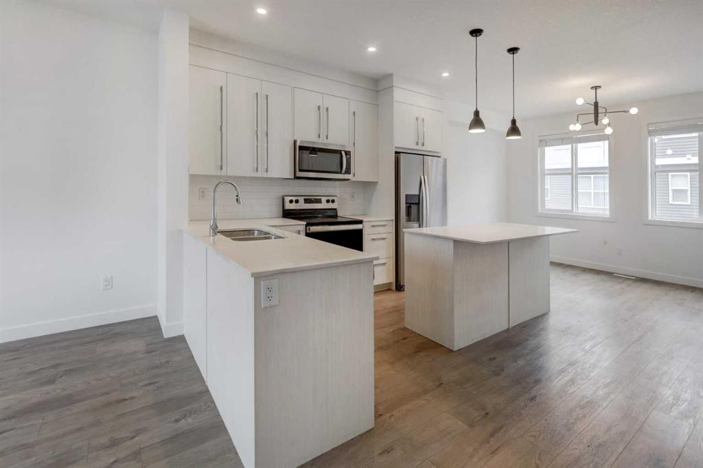 705-50 Cornerstone Passage Ne, Calgary, AB - Indoor Photo Showing Kitchen With Stainless Steel Kitchen With Double Sink With Upgraded Kitchen