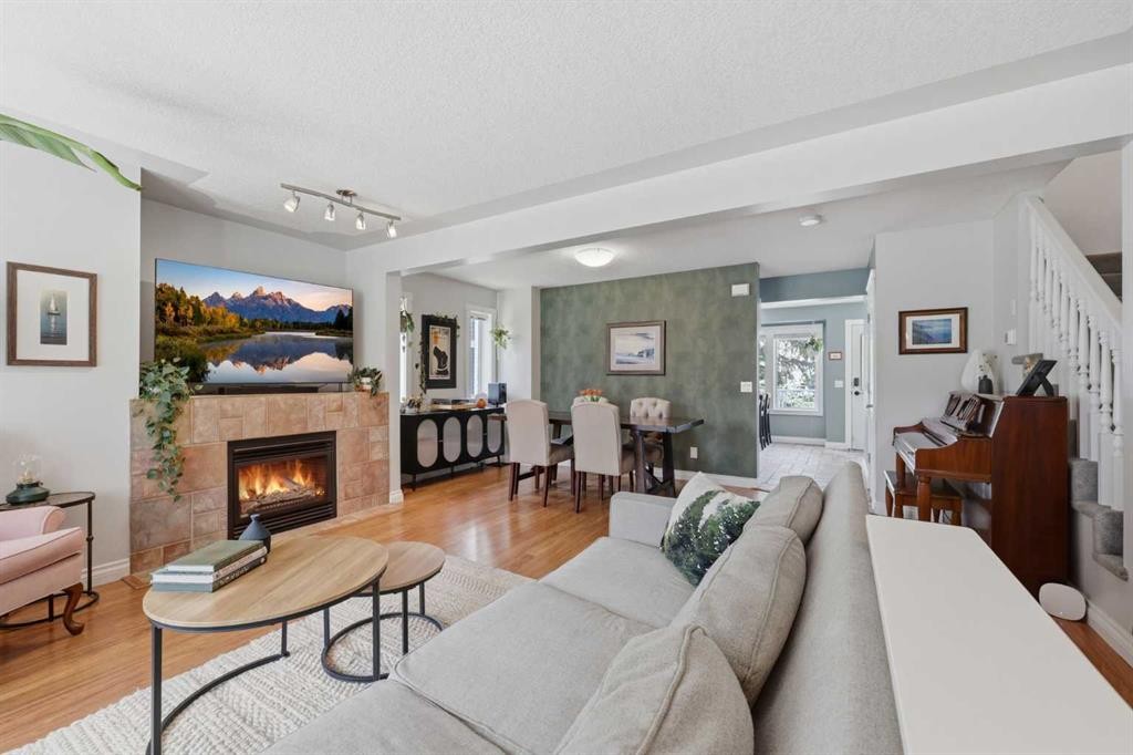 450 Regal Park Ne, Calgary, AB - Indoor Photo Showing Living Room With Fireplace