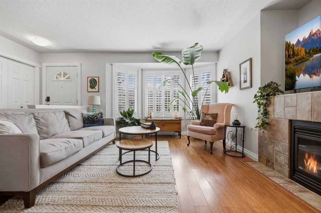 450 Regal Park Ne, Calgary, AB - Indoor Photo Showing Living Room With Fireplace
