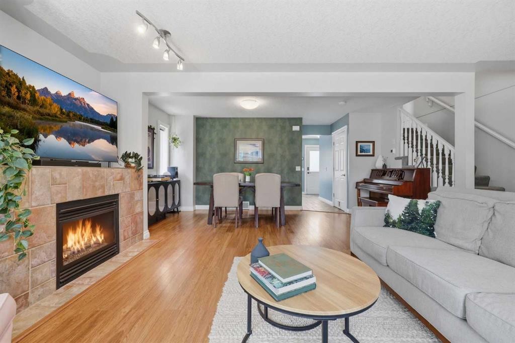 450 Regal Park Ne, Calgary, AB - Indoor Photo Showing Living Room With Fireplace