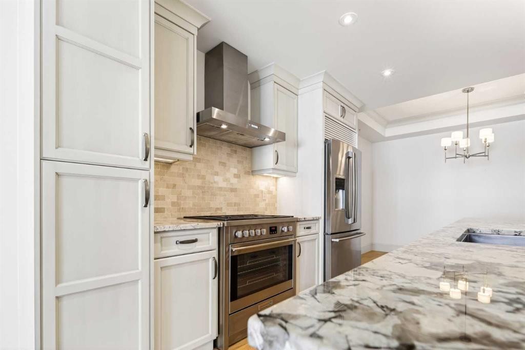 305-221 Quarry Way Se, Calgary, AB - Indoor Photo Showing Kitchen With Upgraded Kitchen