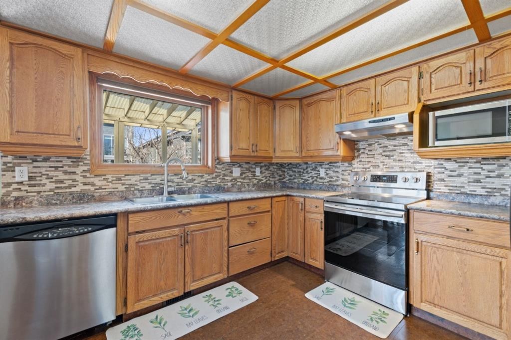 133 Carr Crescent, Okotoks, AB - Indoor Photo Showing Kitchen With Double Sink